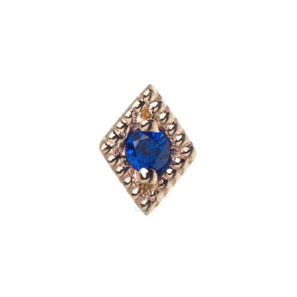 "Harlequin" Nostril Screw In Gold With Dark Blue CZ 1 "Harlequin" Nostril Screw In Gold With Dark Blue CZ