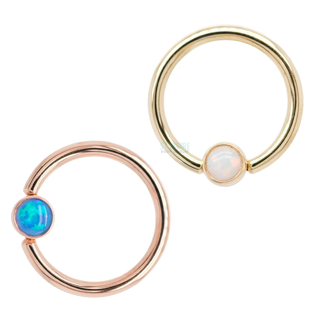 Captive Bead Ring (CBR) In Gold With Bezel-set Dark Blue Opal Captive Bead